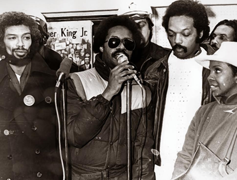 Photo of Stevie Wonder, Gil Scott Heron, Reverend Jesse Jackson, Gladys Knight and Sam Courtney at a press conference at Rafu Gallery, Washington, DC, January 15, 1981.