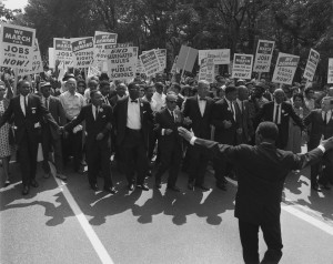 Civil rights marchers holding signs demanding equal rights to work