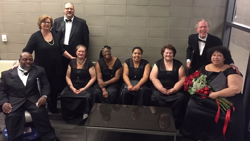 Members of the Dallas Street Choir relax, looking dapper and professional in formal wear.