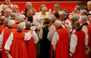 The Venerable Rachel Treweek during the symbolic laying of the hands ceremony at her consecration as a Bishop by the Archbishop of Canterbury Justin Welby (middle) at a service in Canterbury Cathedral.