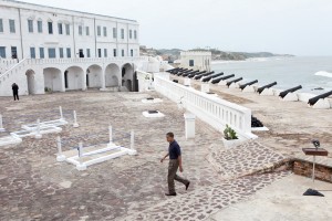 President Barack Obama finishes an address following a tour with his family of Cape Coast Castle in Ghana on July 11, 2009.   (Official White House photo by Pete Souza) This official White House photograph is being made available for publication by news organizations and/or for personal use printing by the subject(s) of the photograph. The photograph may not be manipulated in any way or used in materials, advertisements, products, or promotions that in any way suggest approval or endorsement of the President, the First Family, or the White House. )