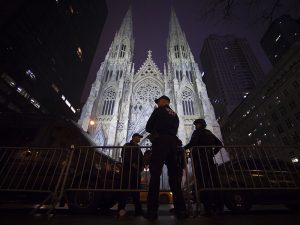 NYC police stand guard outside St Patrick's Cathedral during midnight mass back in Dec. 25, 2014. 