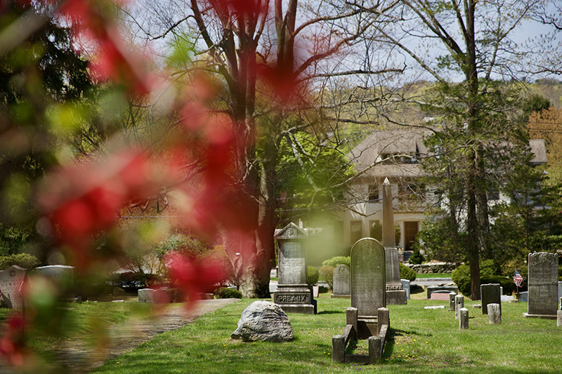 A church graveyard with spring flowers (St. James the Less in Scarsdale, New York)