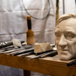 bust of elie weisel on a workbench