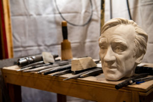 bust of elie weisel on a workbench